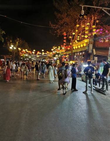 A bustling night market with colorful lanterns.