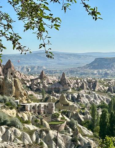A panoramic view of fairy chimneys and rock formations in Cappadocia.