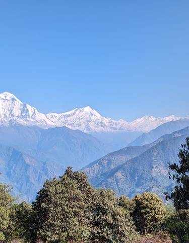 Snow-capped mountains with a clear blue sky.