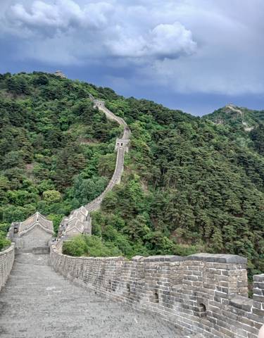 Great Wall of China stretching over mountains.