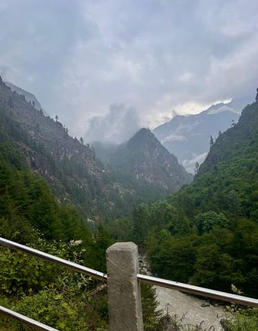 Verdant mountainous landscape shrouded in clouds