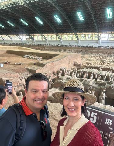 Couple in front of the Terracotta Army excavation site.