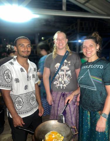 Three people posing for a picture, smiling at the camera.