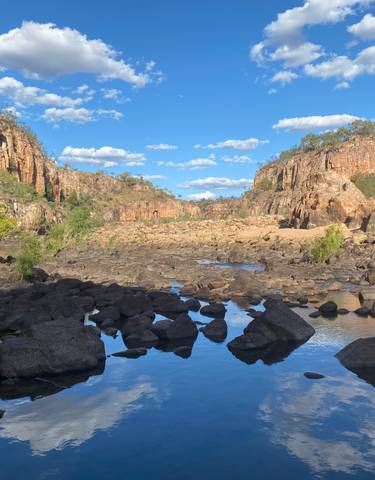 Gorge with rock formations and a river.