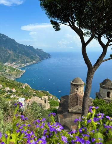Scenic coastal view with cliffs and villages.