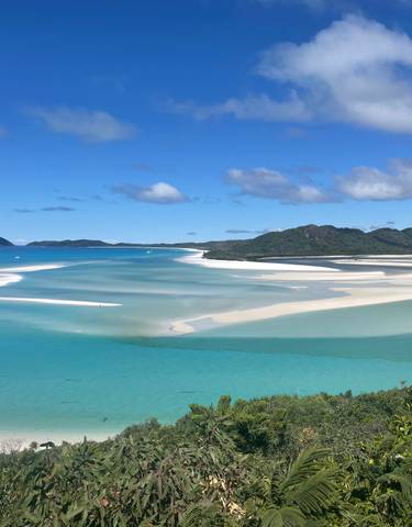 Stunning view of the Whitsunday Islands with turquoise waters and white sand.