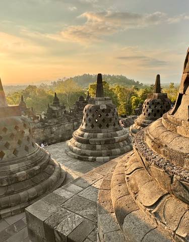 Ancient temple structures during sunrise.