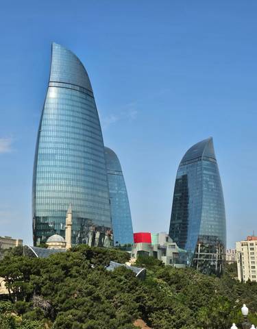 Three modern towers with reflective glass surfaces.