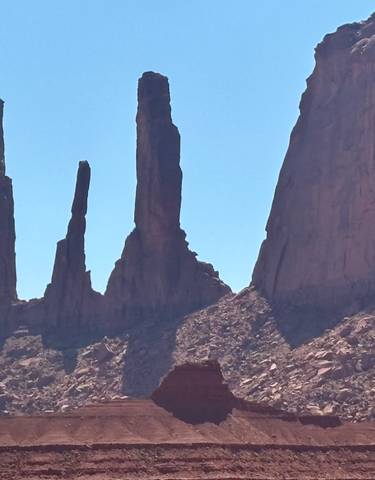 Dramatic rock formations in a desert landscape.