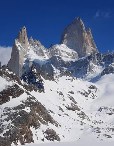Magnificent snowy mountain peaks and a blue sky backdrop.