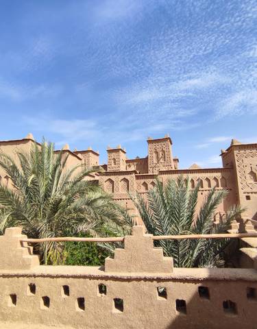 Beautiful kasbah with palm trees.