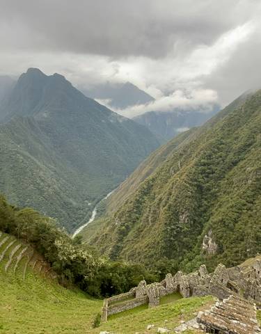 Panorama of mountainous landscape in cloudy weather.