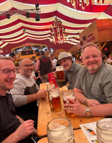 Group of men enjoying beers indoors