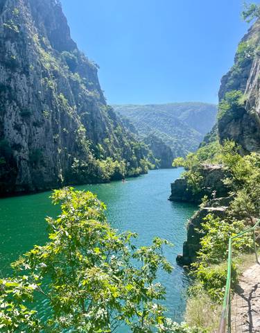 River gorge with deep green waters and steep cliffs.