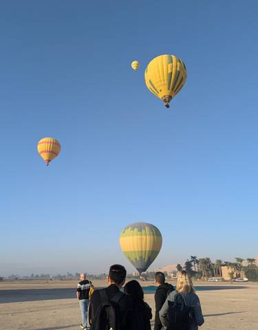 Hot air balloons in the sky at sunrise.