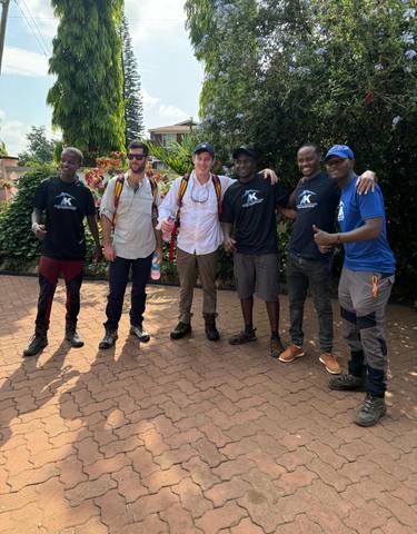 Group of hikers posing in outdoor gear, ready for a trek.
