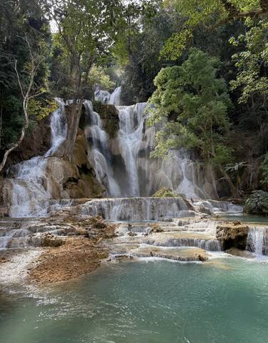 Beautiful waterfall cascading down several tiers surrounded by greenery.