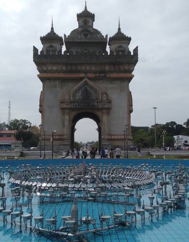 Arch structure with people walking through it.