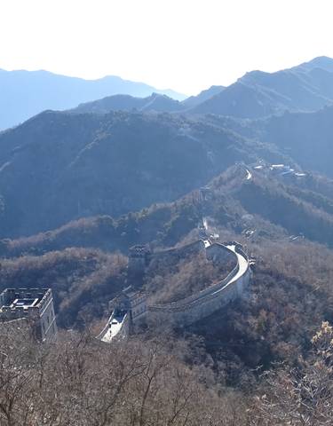 Aerial view of the Great Wall of China on a mountain range.