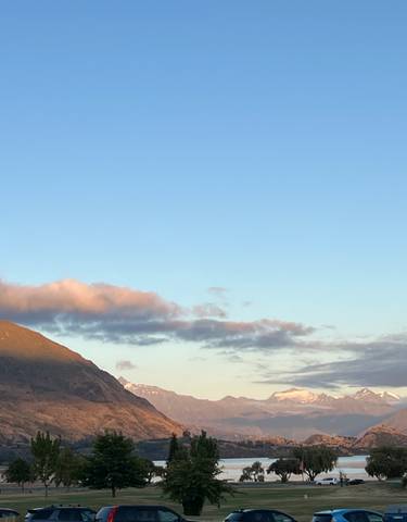 Panoramic view of a mountainous landscape under a clear sky.
