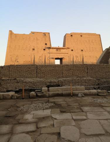 Ancient Egyptian temple facade with carvings.