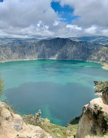 A scenic view of a large crater lake.