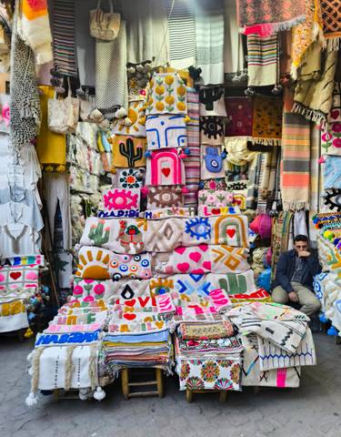 Colorful textiles displayed at a market stall.