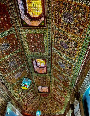 Intricately decorated ceiling with colorful patterns.