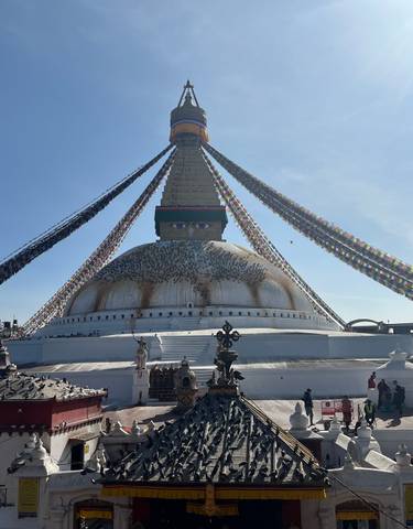 Large stupa with prayer flags, known as Boudhanath Stupa.