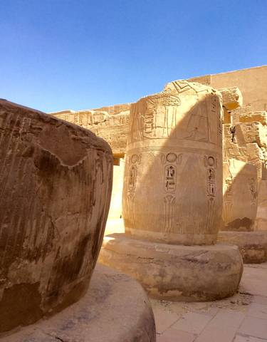 Detailed carvings on Egyptian temple columns.
