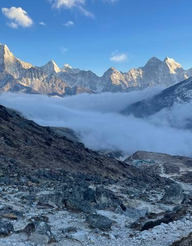A panoramic view of mountains and a cloud-filled valley.