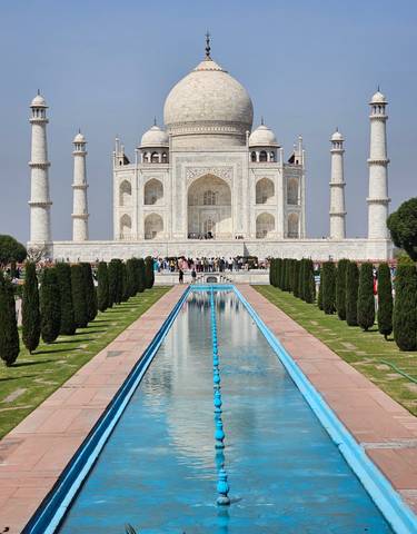 Taj Mahal with ornamental gardens in the foreground.