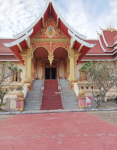 Steps leading to an ornately designed temple entrance.