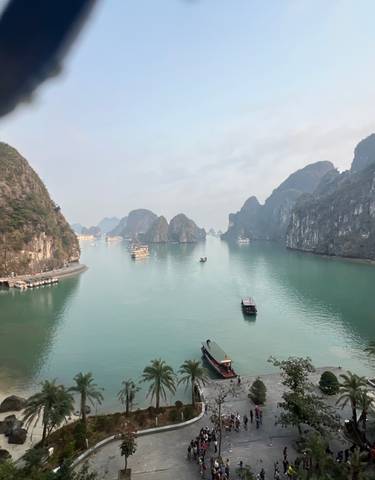 Beautiful view of Halong Bay with boats and limestone formations.