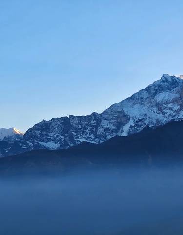 Mountain range with snow-covered peaks.
