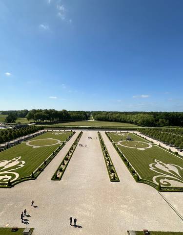 Well-manicured garden with symmetrical designs.