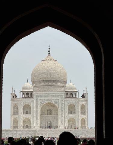Close-up of the Taj Mahal's main dome framed by an archway.