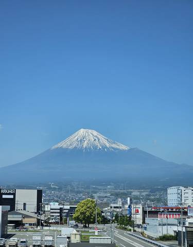 Majestic view of Mount Fuji under a clear blue sky.