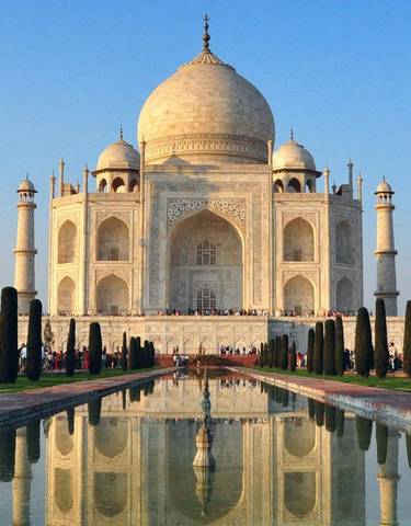 Taj Mahal with reflection in the water in front.