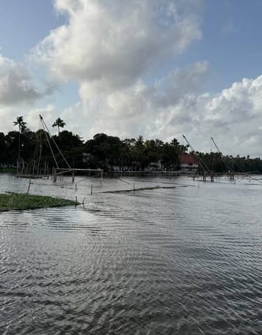 Backwater scene with fishing nets and cloudy sky.
