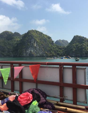 Colorful bunting on a cruise with limestone karsts.