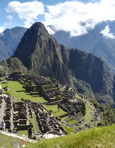 Machu Picchu with surrounding Andes mountains.