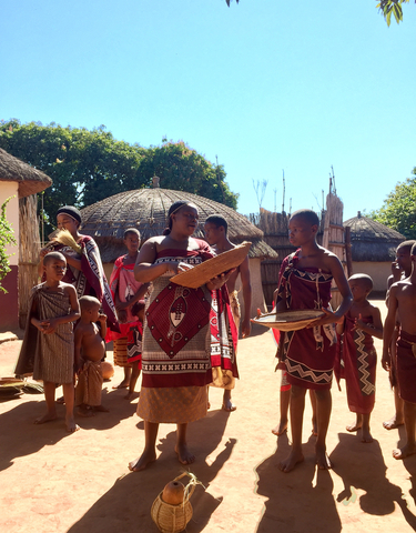 Group of people in traditional attire in a cultural setting.