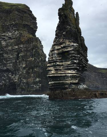 Close-up of rock formations by the sea.