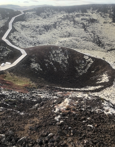 Crater with a staircase beside it.