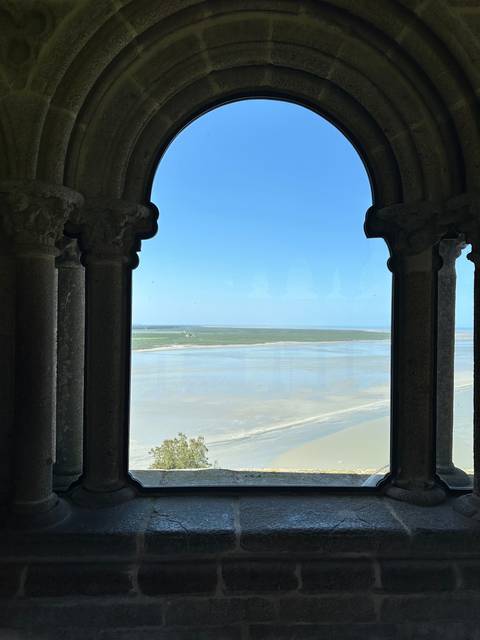 View through a window to a landscape.