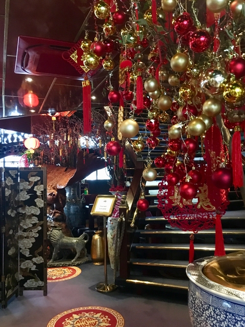 Decorated interior with red and gold ornaments.