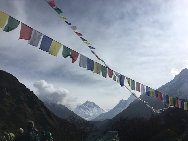 Colorful prayer flags fluttering in the mountain wind.