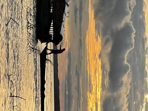 Sunset view with a person in silhouette.