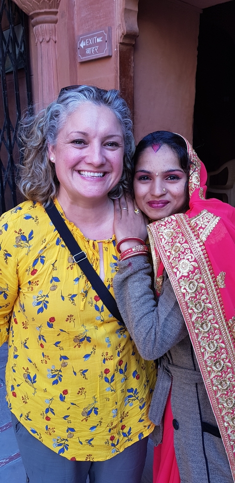 Close-up of two women in traditional attire.